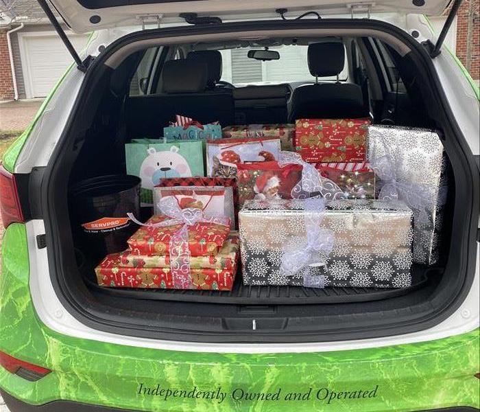 servpro car trunk filled with presents