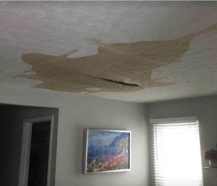 brown water stain on ceiling 