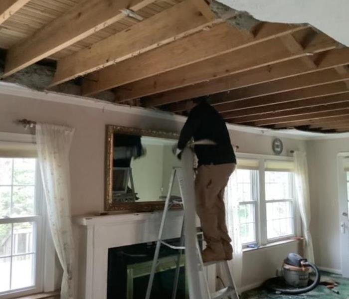 technician removing ceiling
