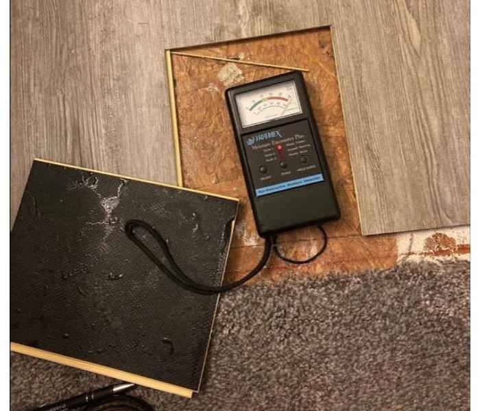 moisture meter on floor